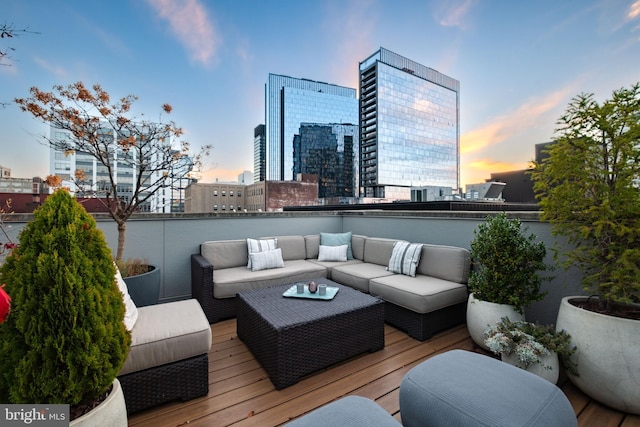 deck at dusk with an outdoor living space