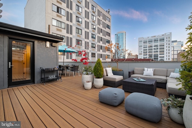 wooden deck featuring outdoor lounge area