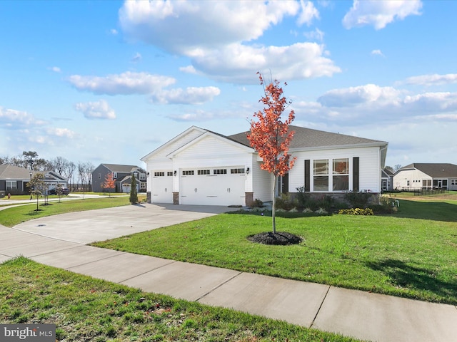 ranch-style house featuring a front lawn and a garage