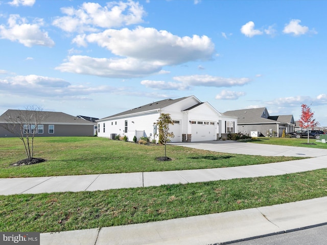 view of front of property featuring a garage and a front lawn