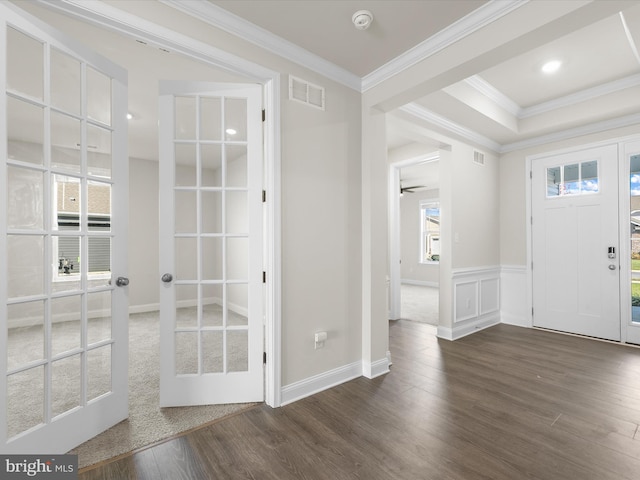 entrance foyer featuring ceiling fan, crown molding, and dark hardwood / wood-style floors