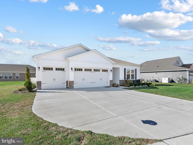 ranch-style house with a front yard and a garage