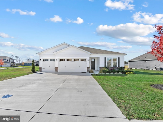 view of front of home featuring a garage and a front lawn