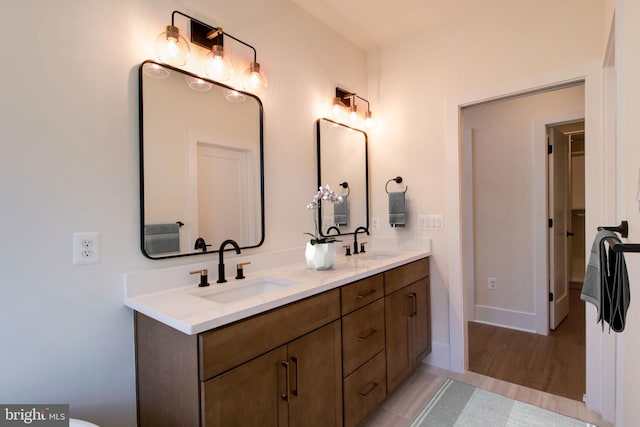 bathroom featuring hardwood / wood-style flooring and vanity