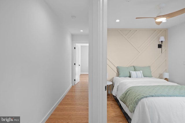 bedroom featuring hardwood / wood-style flooring and ceiling fan