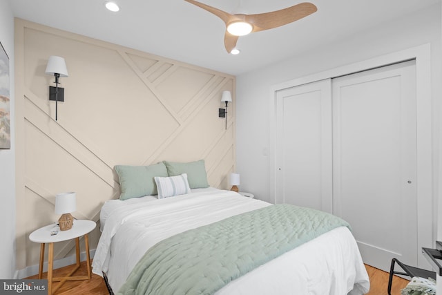 bedroom with ceiling fan and wood-type flooring