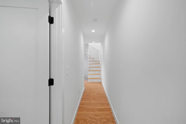 hall with light hardwood / wood-style floors