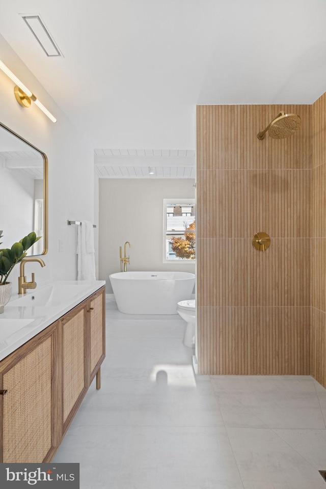 full bathroom featuring toilet, shower with separate bathtub, vanity, and tile patterned floors