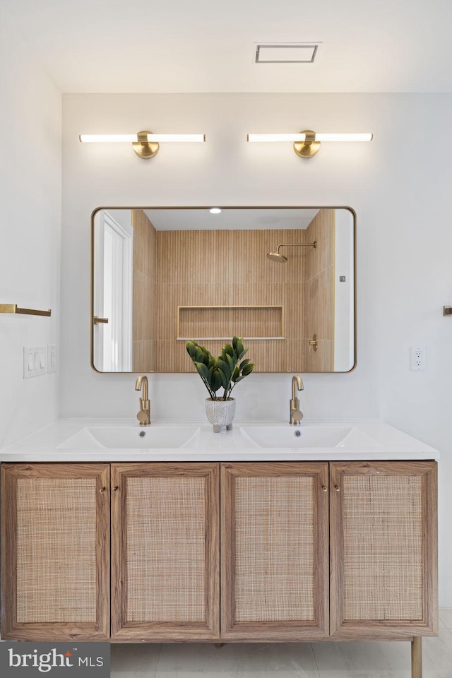 bathroom with tile patterned flooring and vanity