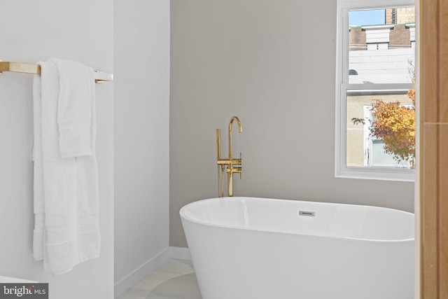 bathroom featuring a bathing tub and tile patterned floors