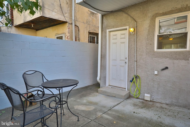 entrance to property featuring a patio area