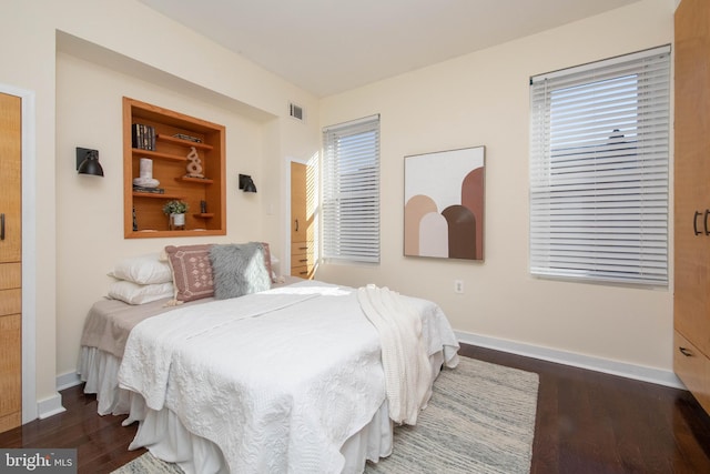 bedroom featuring dark wood-type flooring