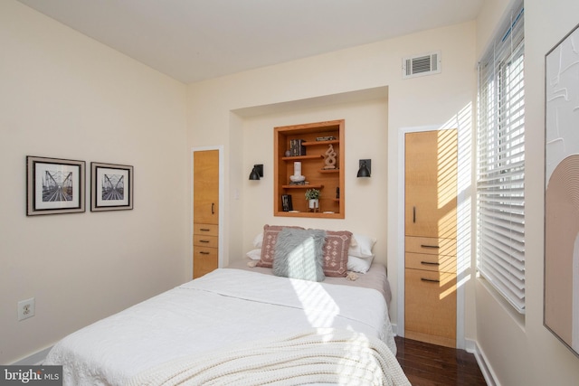 bedroom featuring dark hardwood / wood-style floors