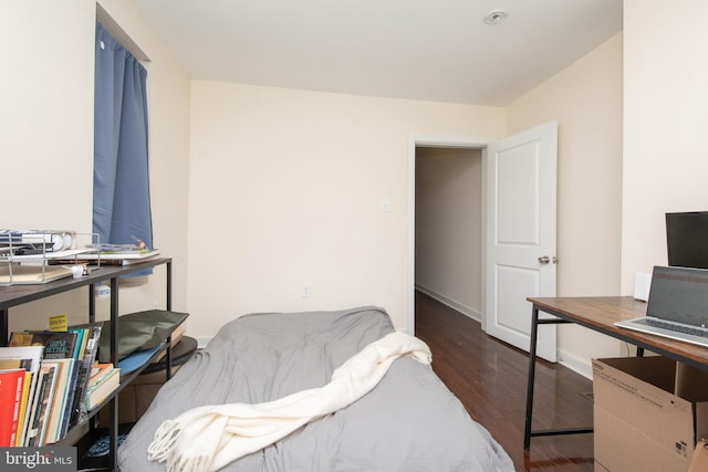 bedroom featuring dark hardwood / wood-style floors