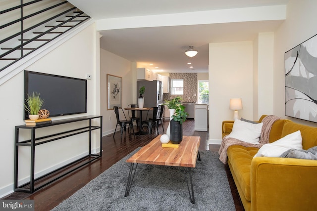 living room with dark hardwood / wood-style flooring