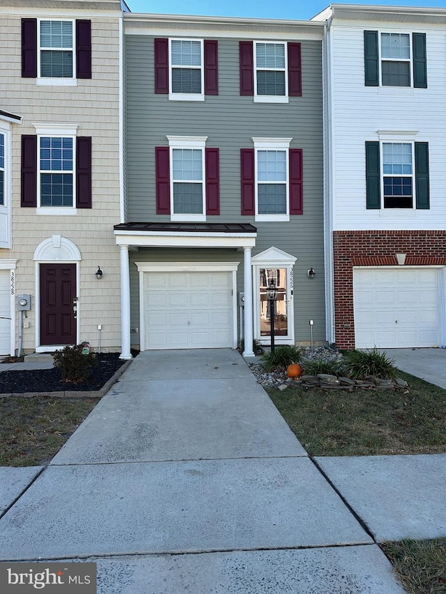 multi unit property featuring a garage