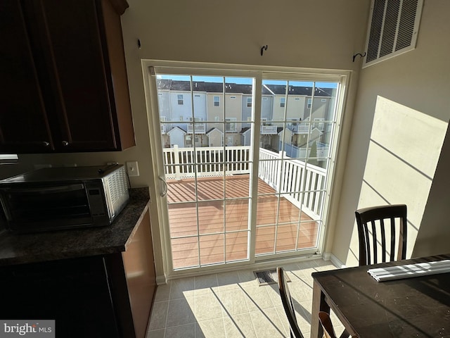 entryway featuring light tile patterned floors