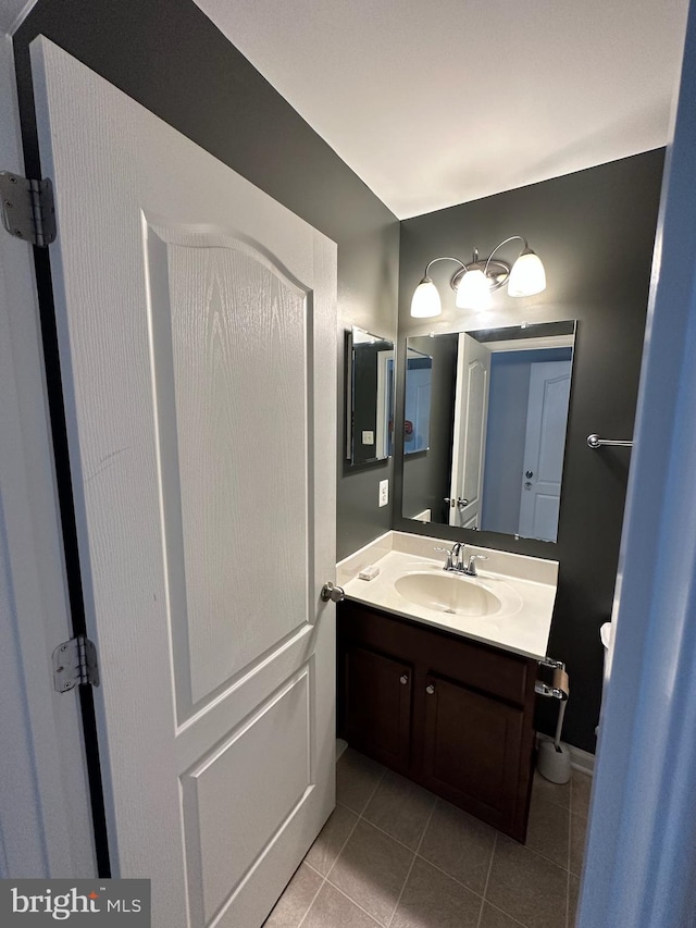 bathroom with tile patterned floors and vanity