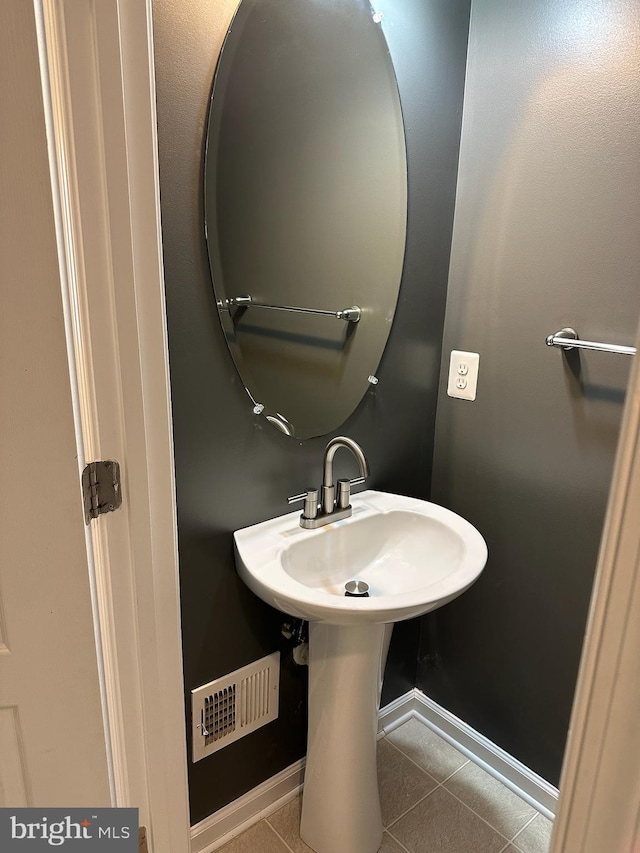 bathroom featuring tile patterned flooring and sink