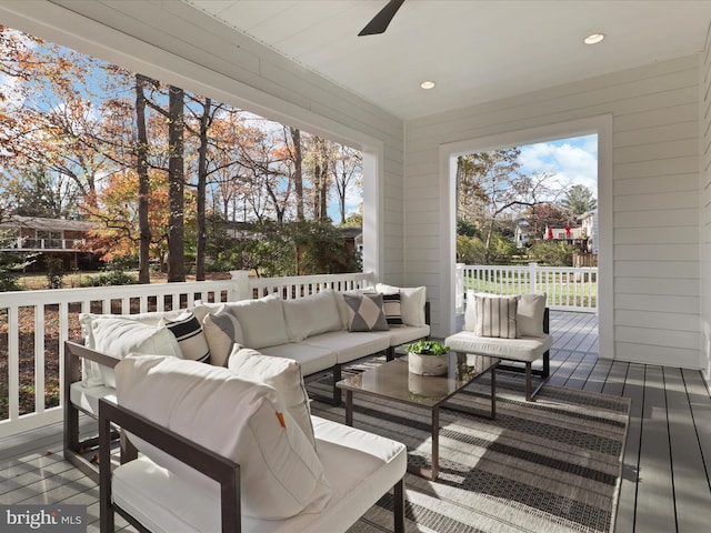 wooden terrace featuring an outdoor hangout area