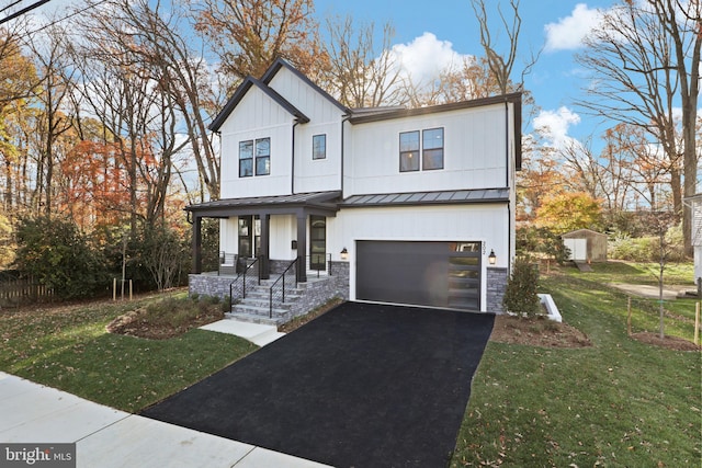 modern farmhouse with covered porch, a garage, and a front lawn