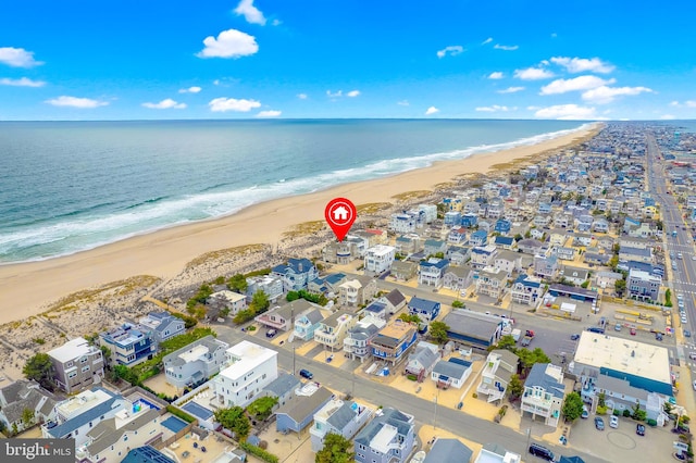 aerial view featuring a water view and a beach view