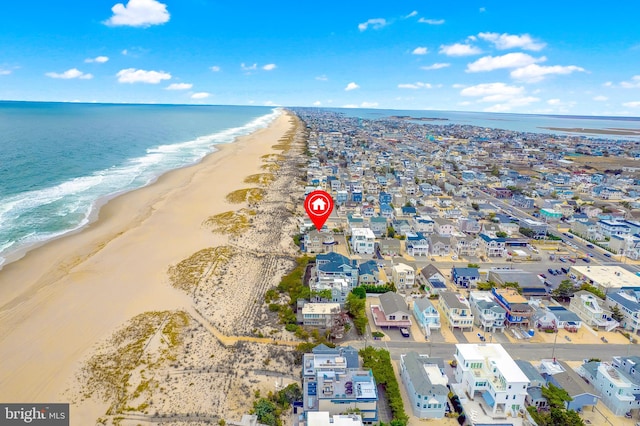 aerial view featuring a view of the beach and a water view