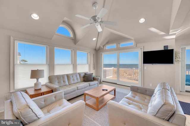 carpeted living room featuring ceiling fan and vaulted ceiling