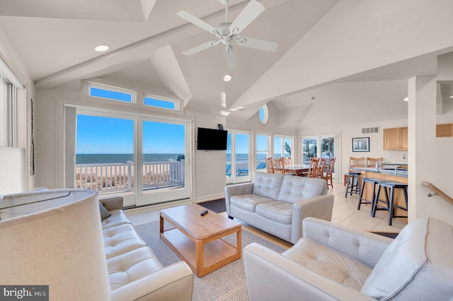 living room featuring ceiling fan and high vaulted ceiling