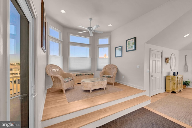 sitting room featuring ceiling fan, light hardwood / wood-style floors, and a wealth of natural light