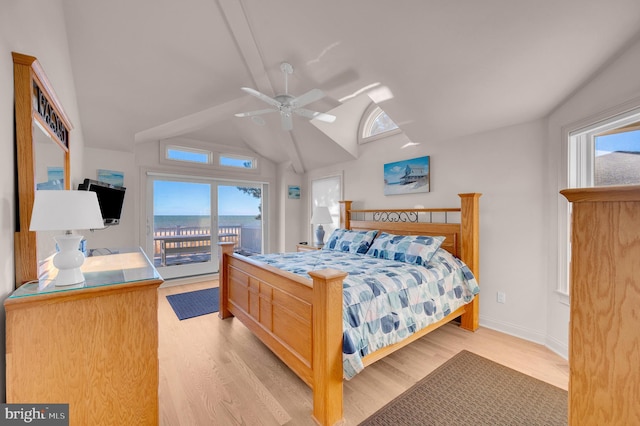 bedroom featuring ceiling fan, light hardwood / wood-style floors, access to outside, and vaulted ceiling