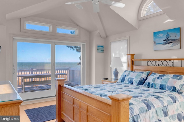 bedroom with a water view, multiple windows, light hardwood / wood-style floors, and ceiling fan