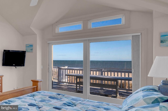 bedroom with a water view, wood-type flooring, and lofted ceiling