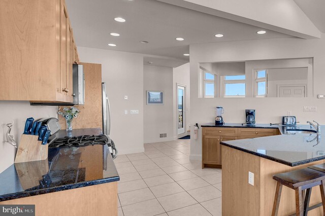 2 N 2nd St, Surf City, NJ 08008 - kitchen with a sink, a kitchen breakfast bar, recessed lighting, light tile patterned floors, and baseboards