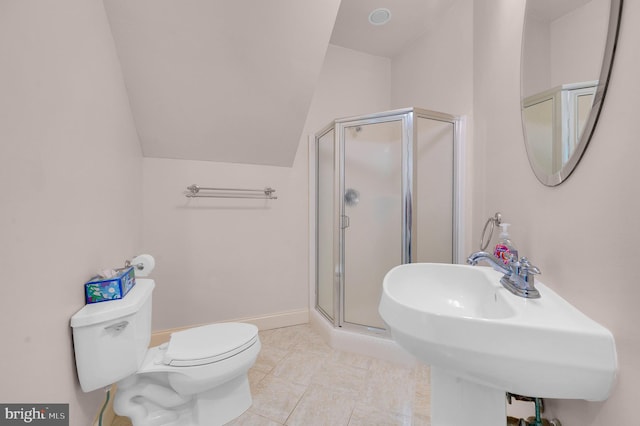 bathroom with vaulted ceiling, sink, tile patterned flooring, toilet, and a shower with shower door