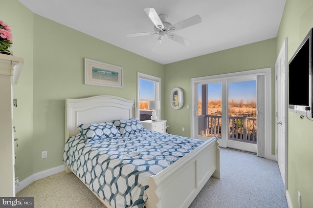 carpeted bedroom with ceiling fan and access to exterior