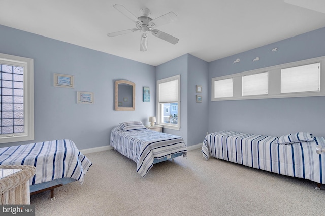 bedroom with ceiling fan and carpet