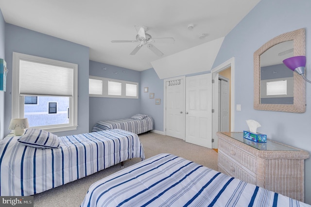 bedroom featuring carpet floors, ceiling fan, and lofted ceiling