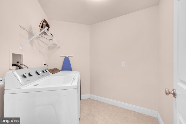 2 N 2nd St, Surf City, NJ 08008 - laundry area featuring washing machine and clothes dryer, baseboards, and light tile patterned floors