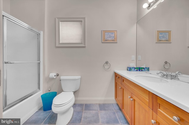 full bathroom featuring tile patterned flooring, vanity, toilet, and bath / shower combo with glass door