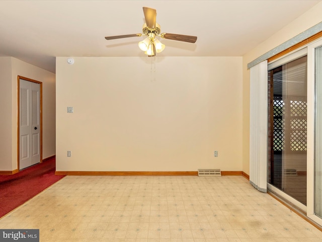 spare room with ceiling fan