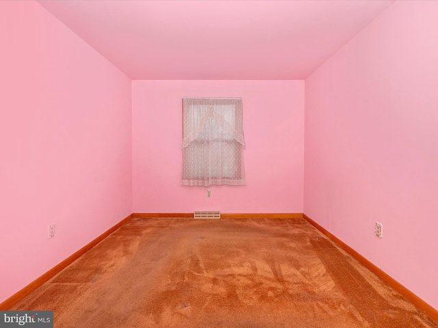 spare room featuring carpet