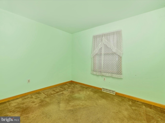 unfurnished room with carpet