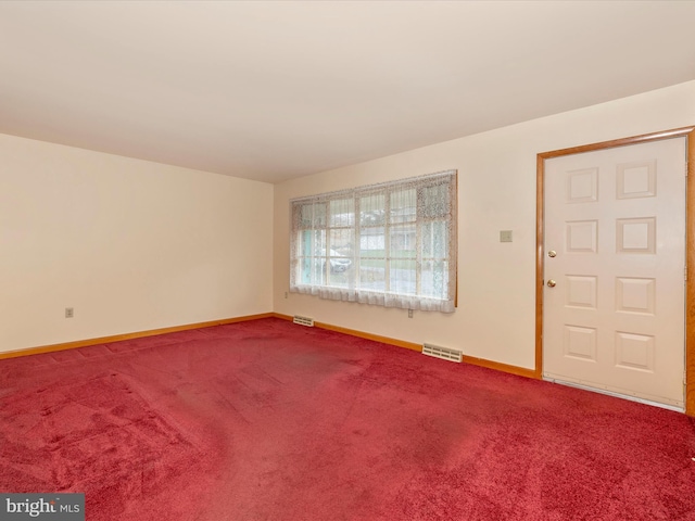 empty room with carpet flooring