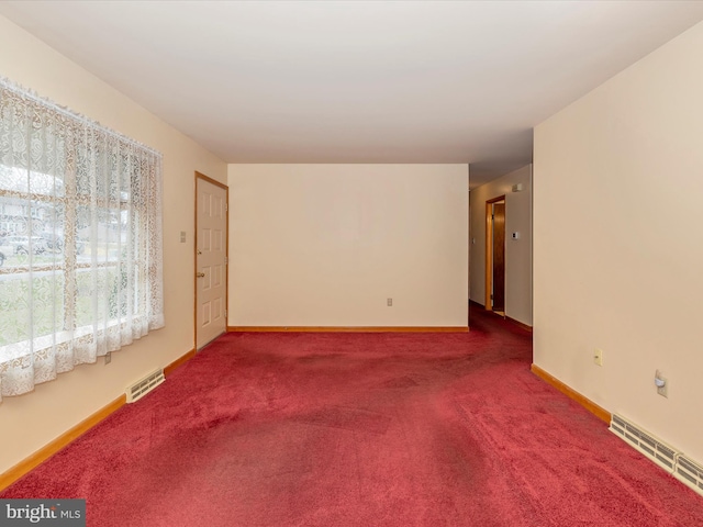 unfurnished room featuring carpet