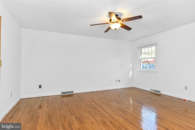 spare room featuring ceiling fan and light hardwood / wood-style floors