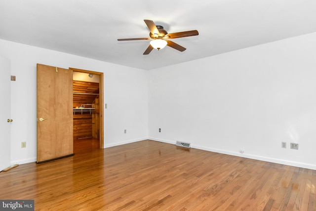 interior space with hardwood / wood-style flooring and ceiling fan