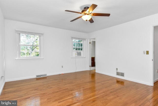 empty room featuring hardwood / wood-style flooring and plenty of natural light