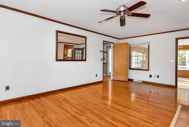 spare room with ceiling fan, crown molding, and light hardwood / wood-style flooring