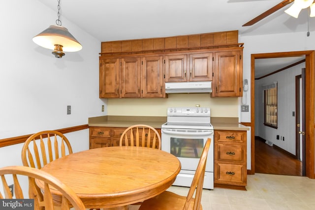 kitchen with ceiling fan, white electric stove, and hanging light fixtures